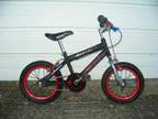 CHILDS BIKE for sale Boys red and black bike for sale....
