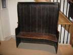 ANTIQUE SETTLE Antique settle in dark wood,  believed to....